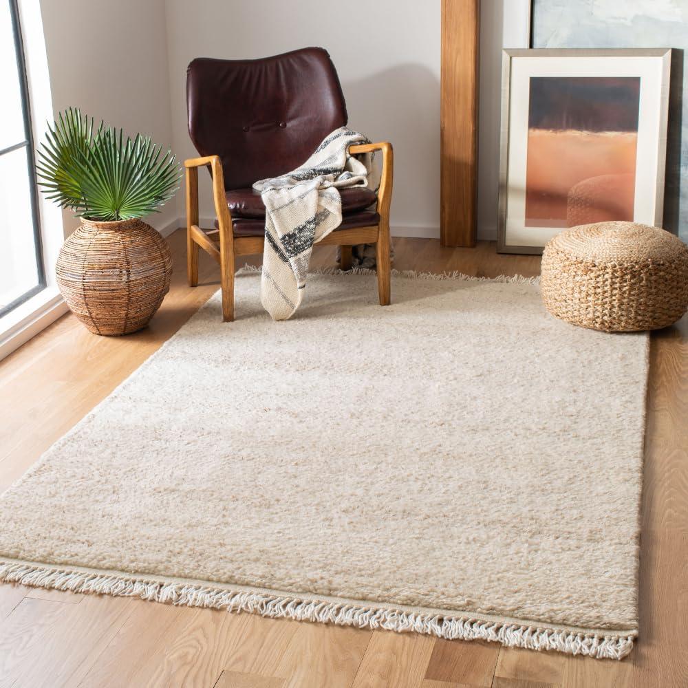 SAFAVIEH Casablanca Carbrey Solid Wool Shag Area Rug, Beige, 4' x 6'