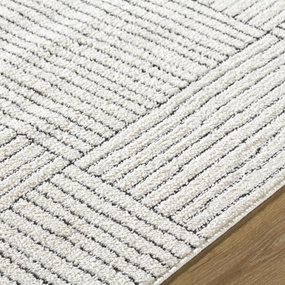 Ivory and Black Geometric Patterned Synthetic Area Rug, 5' x 7'