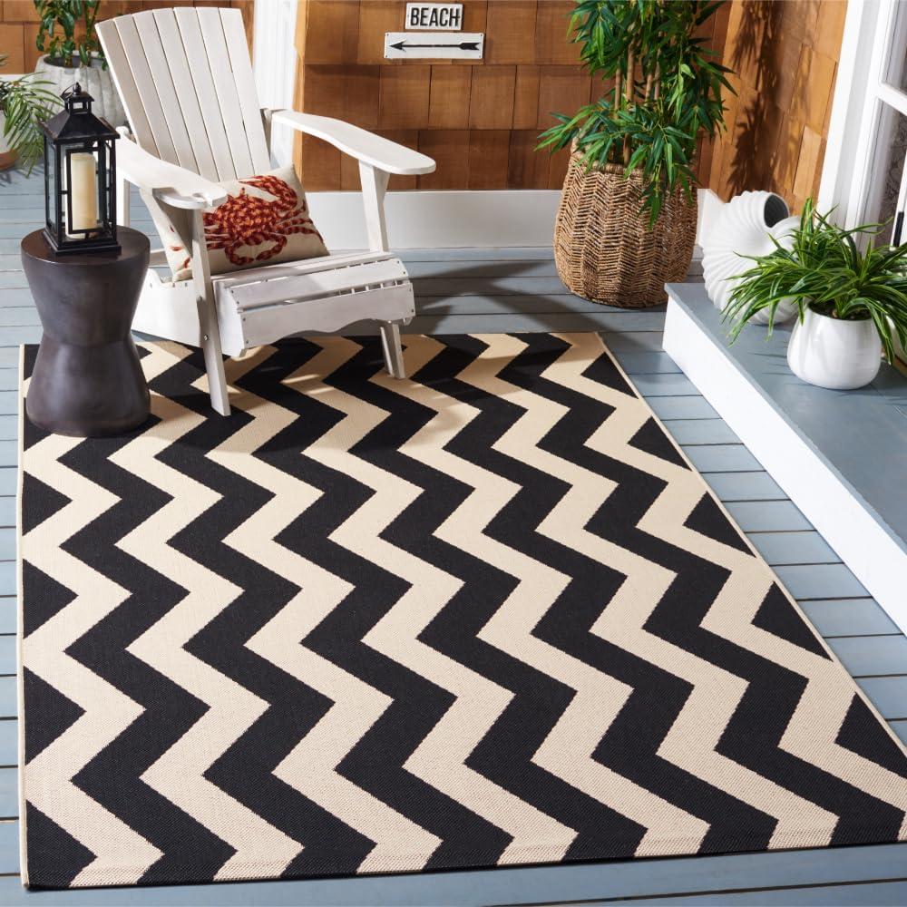 SAFAVIEH Courtyard Ayden Chevron Indoor/Outdoor Area Rug, 6'7" x 9'6", Black/Beige