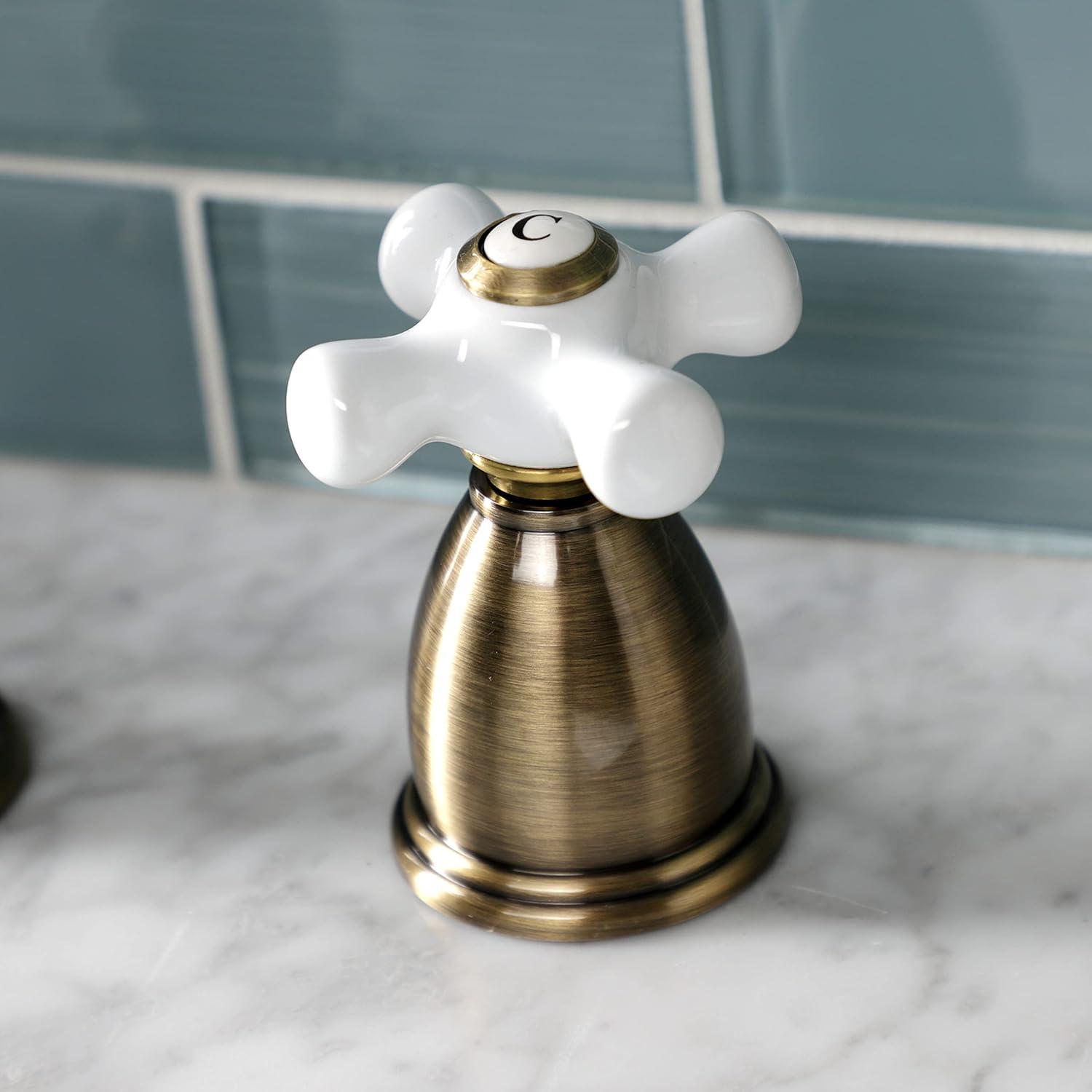 Kingston Brass Heritage Two-Handle 3-Hole Deck Mount Widespread Bathroom Faucet with Pop-Up Drain