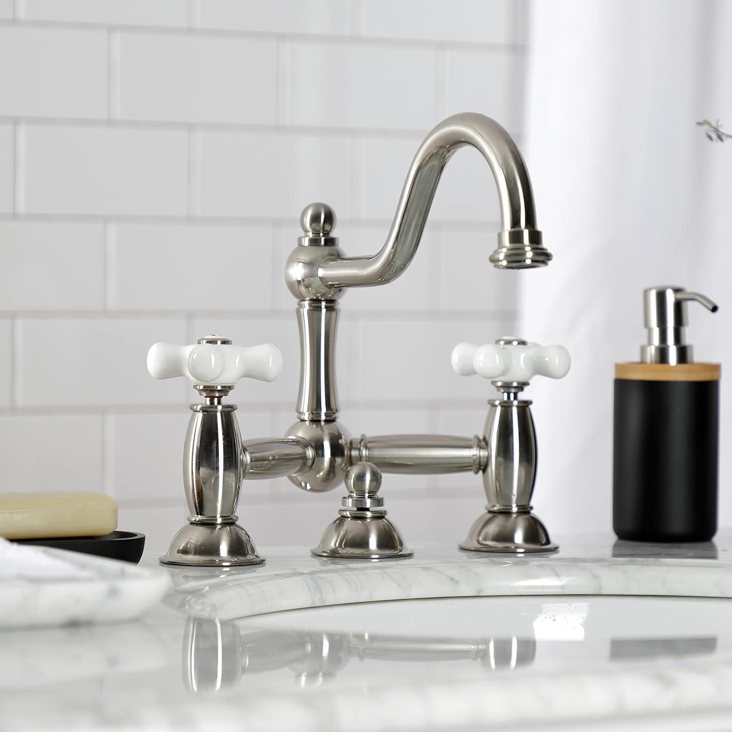 Kingston Brass Restoration Two-Handle 3-Hole Deck Mount Bridge Bathroom Faucet with Brass Pop-Up