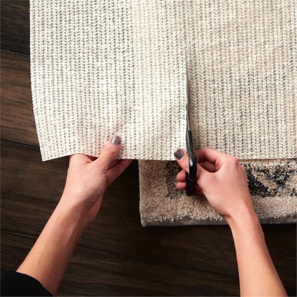 Ebern Designs Rectangle Shiftloc Solid Color Machine Made Polyester/Plastic/Acrylic Area Rug in Ivory