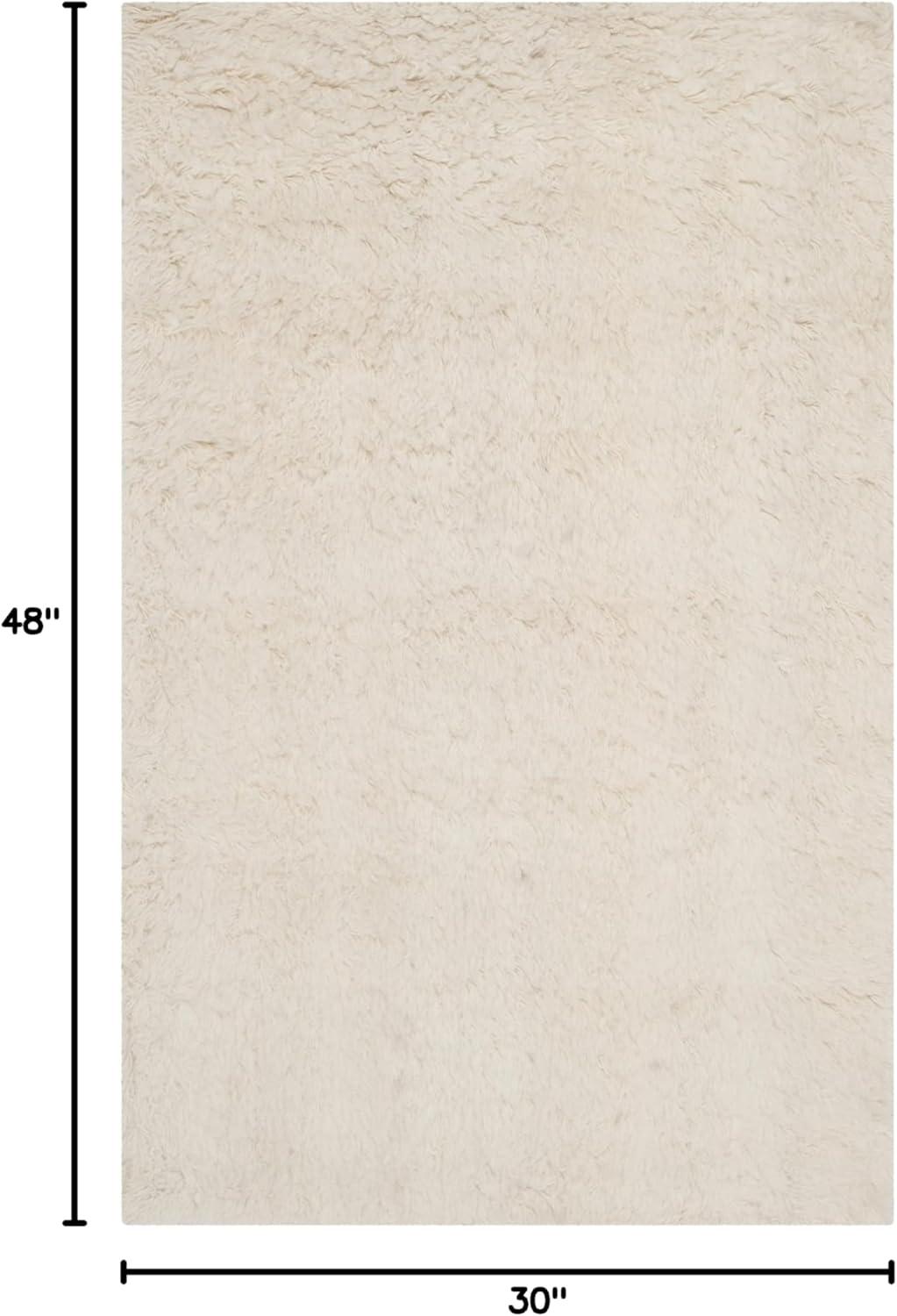 SAFAVIEH Flokati Gisselle Solid Wool Area Rug, Ivory, 2'6" x 4'