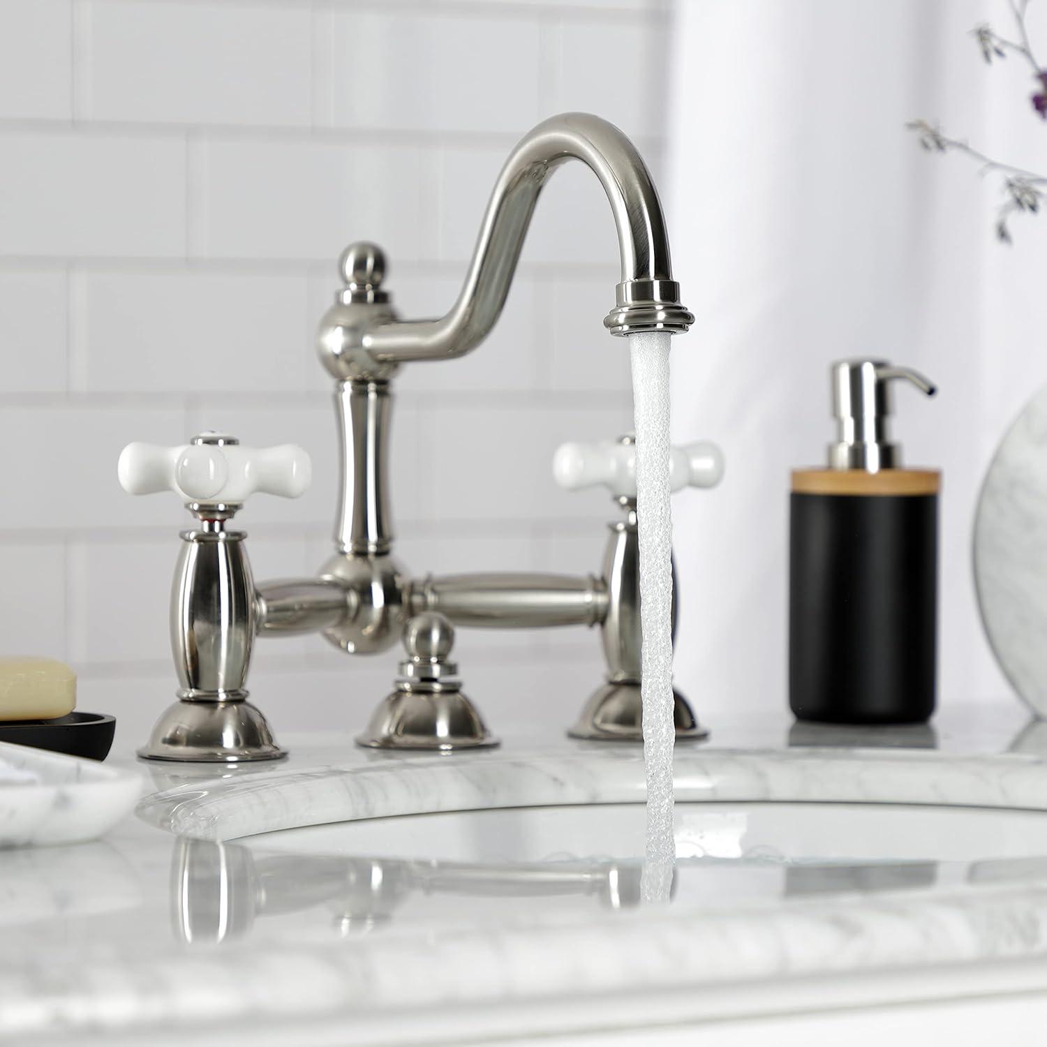 Kingston Brass Restoration Two-Handle 3-Hole Deck Mount Bridge Bathroom Faucet with Brass Pop-Up