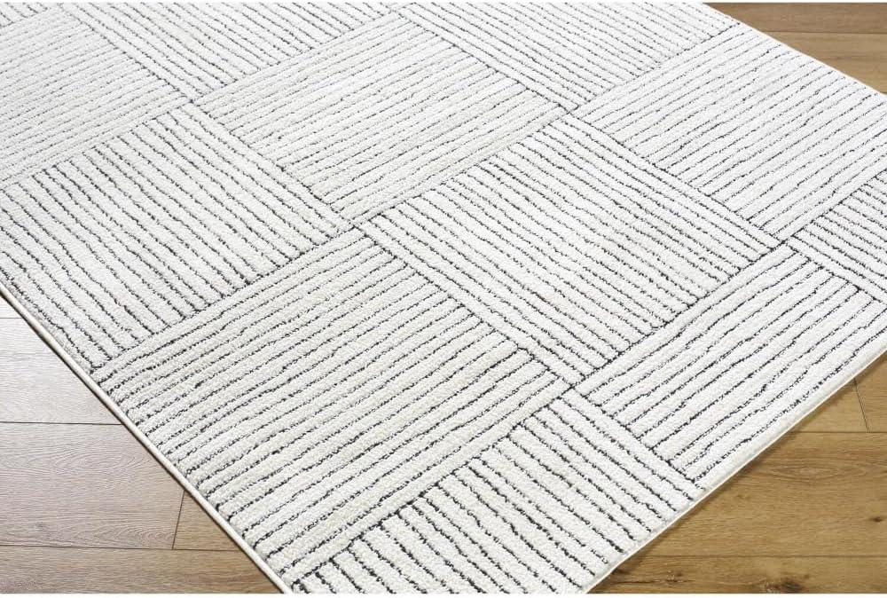 Ivory and Black Geometric Patterned Synthetic Area Rug, 5' x 7'