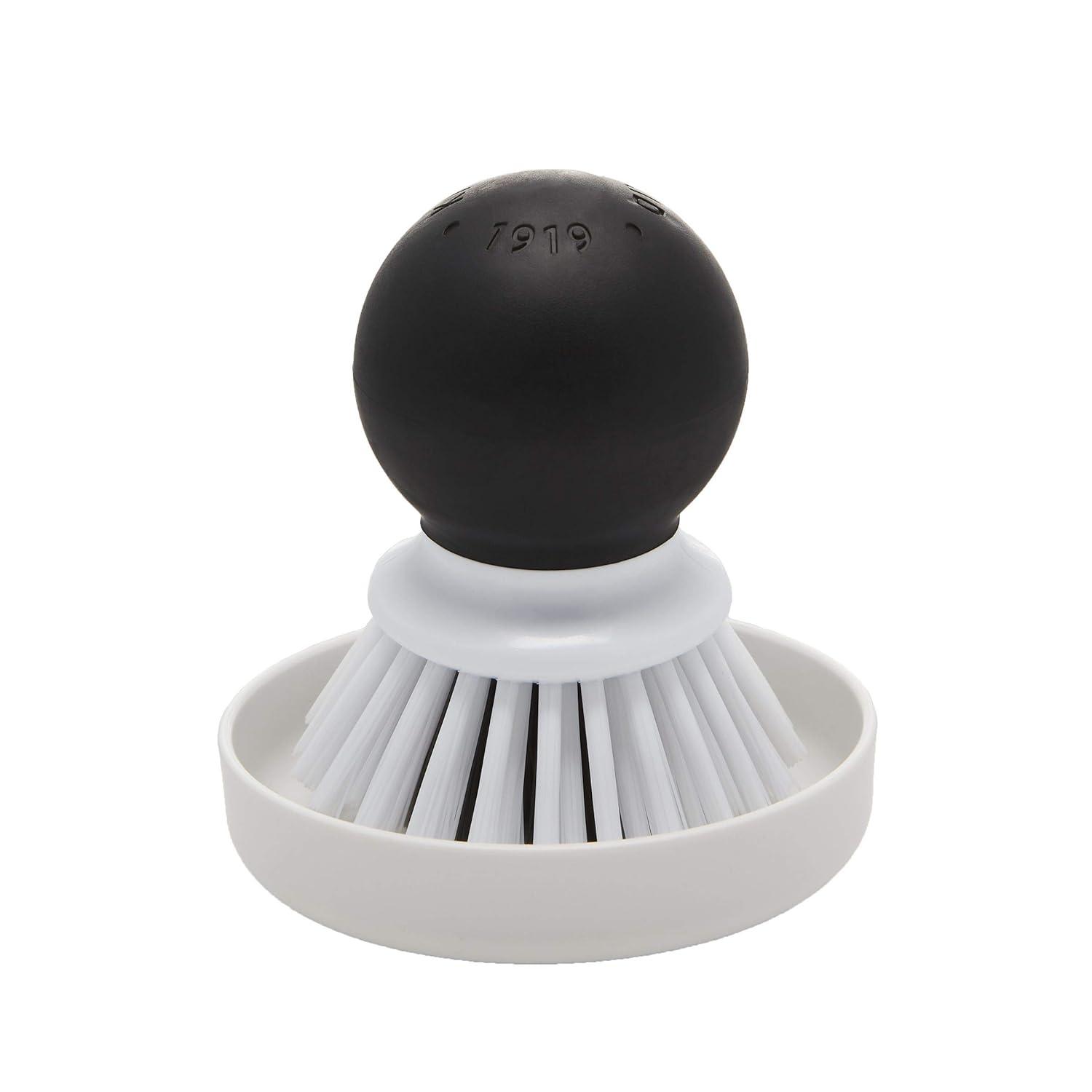 Compact Black and White Plastic Palm Brush with Holder