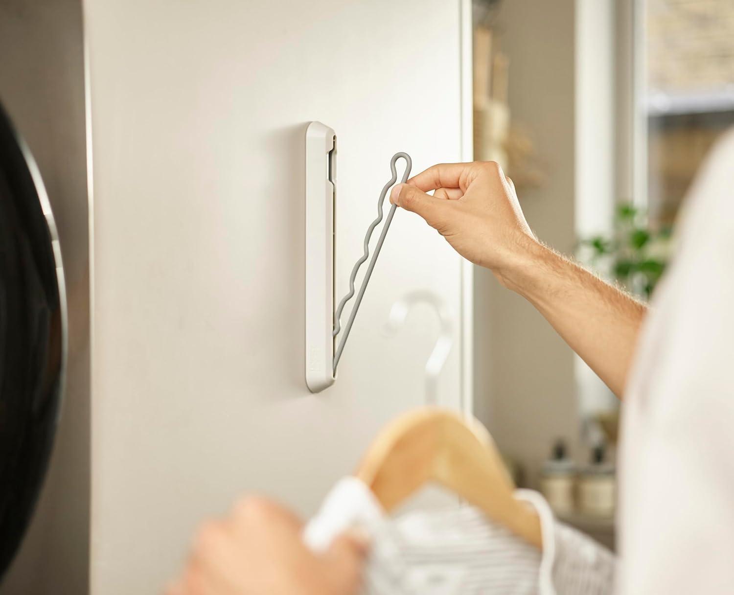 Beige and Gray Foldaway Wall-Mounted Clothes Hanging Rail