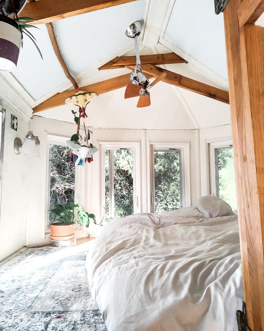 Diane oscillating ceiling fan in Polished Chrome finish with solid matte black wood blades.