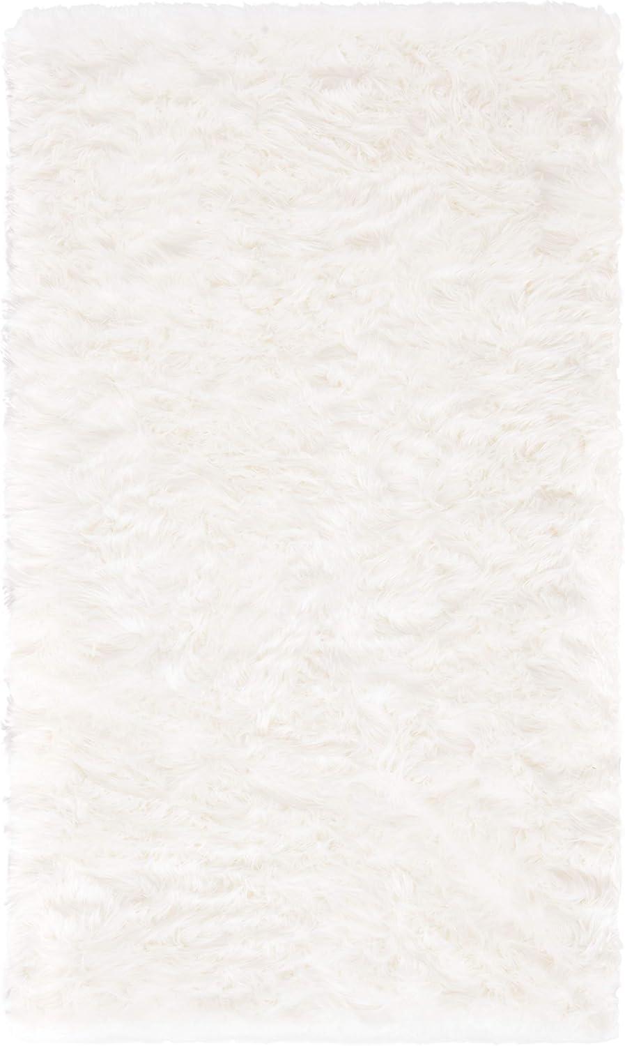 SAFAVIEH Faux Sheep Skin Vesna Solid Plush Area Rug, Ivory, 5' x 7'