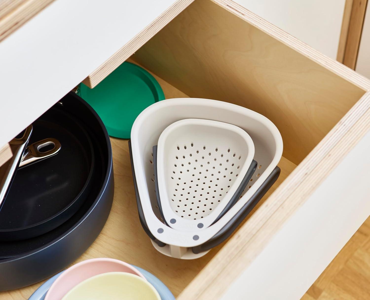 Compact Beige and Black Plastic Colander with Folding Handles