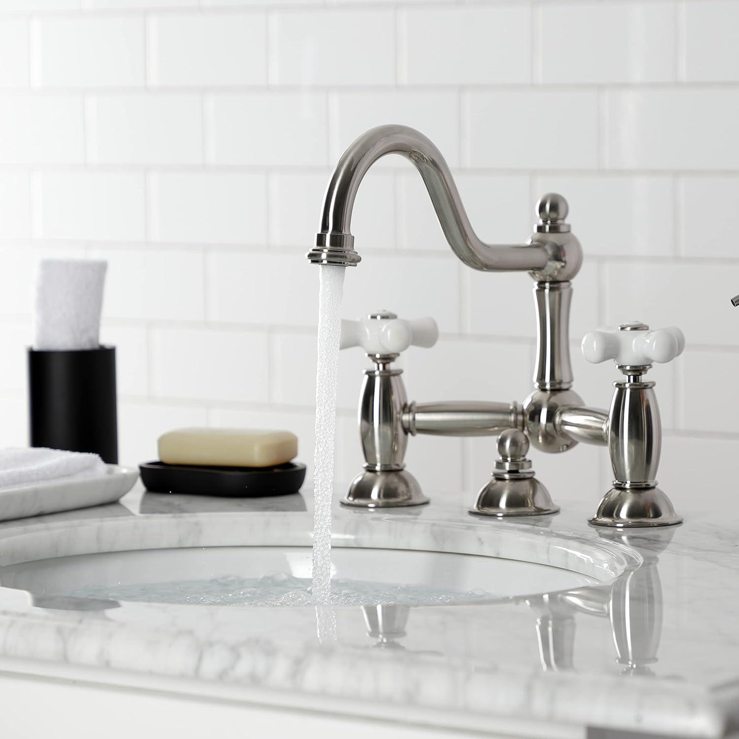 Kingston Brass Restoration Two-Handle 3-Hole Deck Mount Bridge Bathroom Faucet with Brass Pop-Up