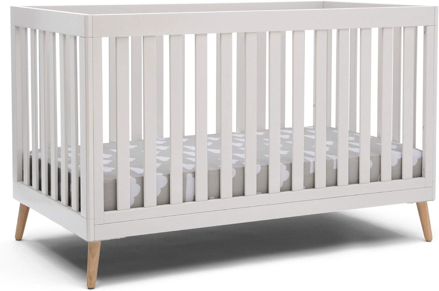 Delta Children Essex 4-in-1 Convertible Baby Crib, Bianca White/Natural Legs