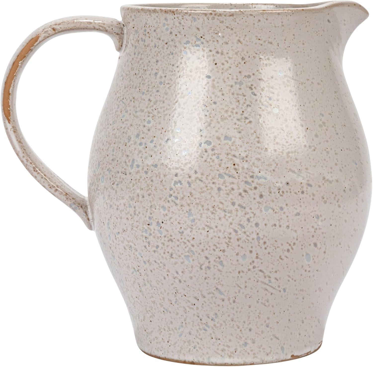 Creative Co-Op 6.75 Inches 50-ounce Debossed Stoneware Pitcher with Flower Design, Reactive Glaze, White and Black