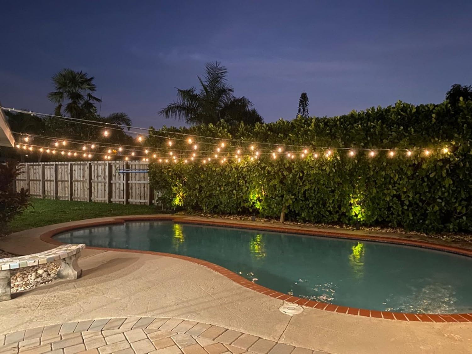 Brightech Ambience Pro 48 ft. Outdoor Solar-Powered LED String Lights with 15 Soft White S14 Bulbs, Weatherproof, Commercial-Grade Cord