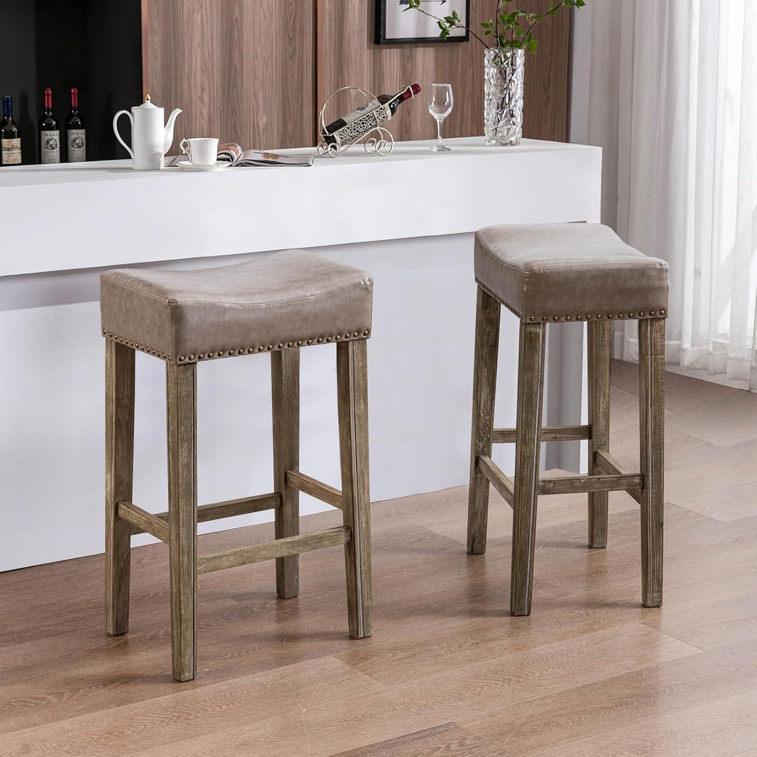Bar Stools Set of 2, 26" Faux PU Leather Upholstered Counter Height Backless Saddle Stools with Nailhead Trims and Solid Wood Legs Farmhouse Island Chairs for Kitchen Dining Room Pub, Gray