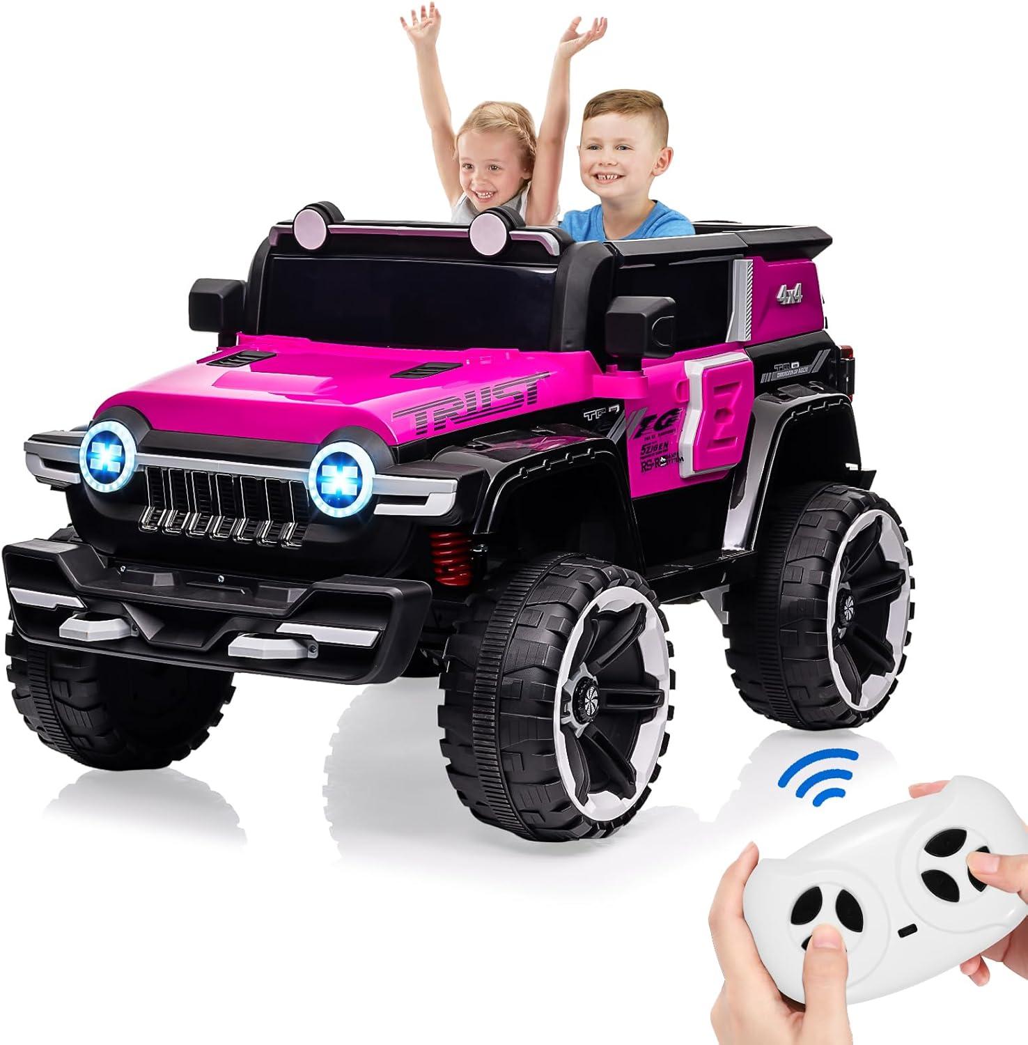 Tuekys 2 Seater Kids Ride On Truck, 12V Battery Powered Electric Vehicle with Spring Suspensions, Remote Control, Decorative Spare Tire, USB, Music, Pink