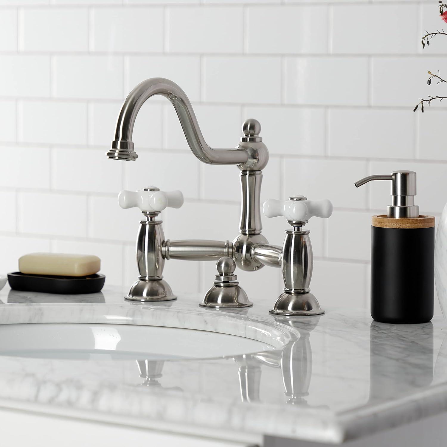 Kingston Brass Restoration Two-Handle 3-Hole Deck Mount Bridge Bathroom Faucet with Brass Pop-Up