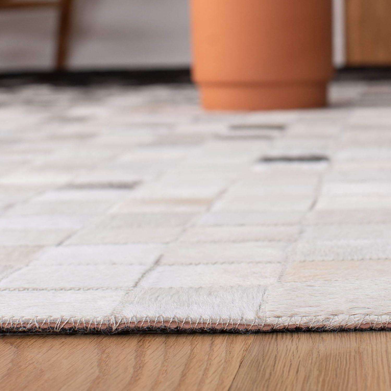 Handmade Black and White Geometric Cowhide Area Rug