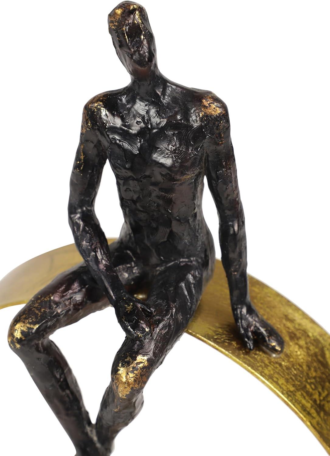 Black and Gold Resin Human Figurine on Circular Base