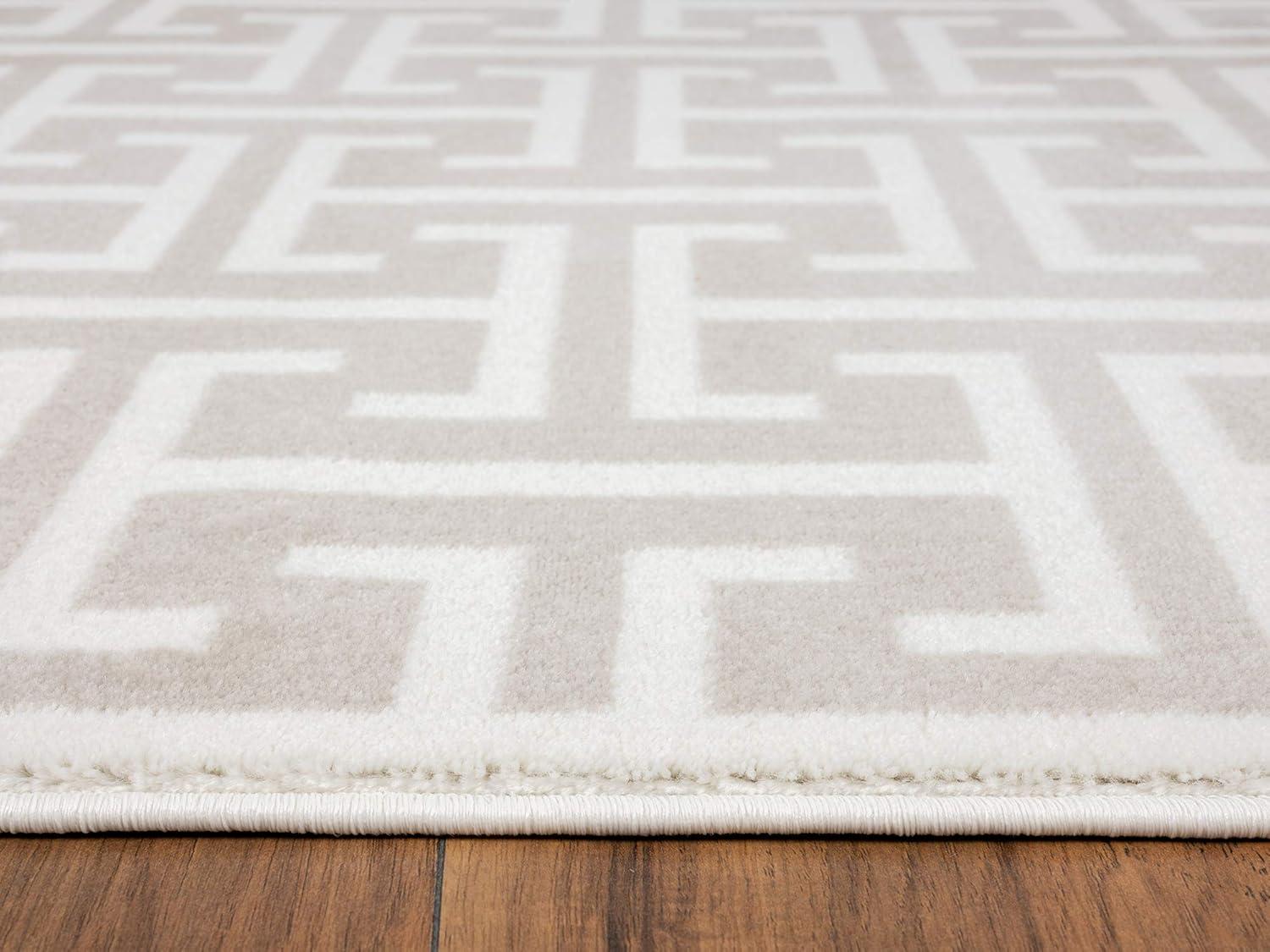 Beige and White Geometric 4' x 6' Synthetic Area Rug