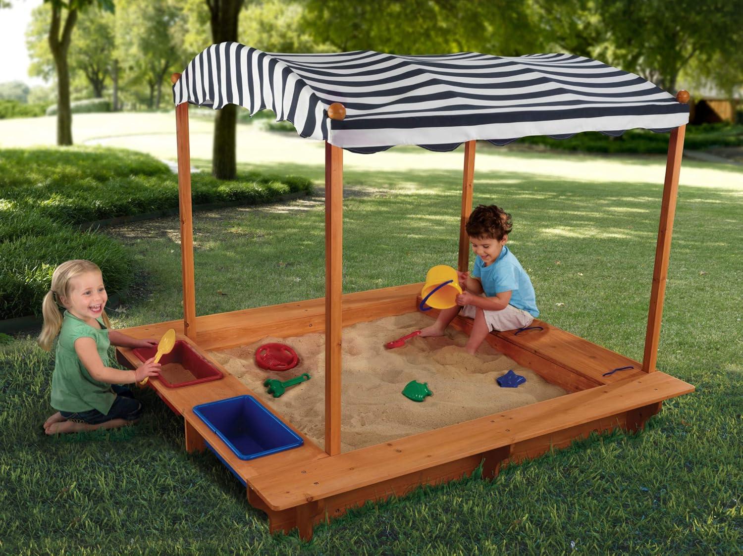 KidKraft Outdoor Covered Wooden Sandbox with Bins and Striped Navy & White Canopy