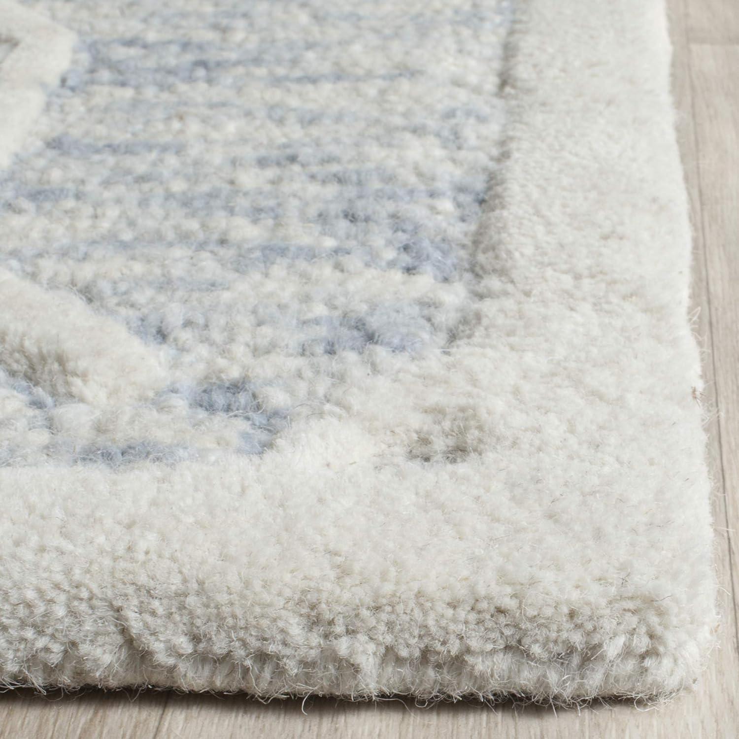SAFAVIEH Cambridge Leland Faded Geometric Wool Area Rug, Light Blue/Ivory, 2' x 3'