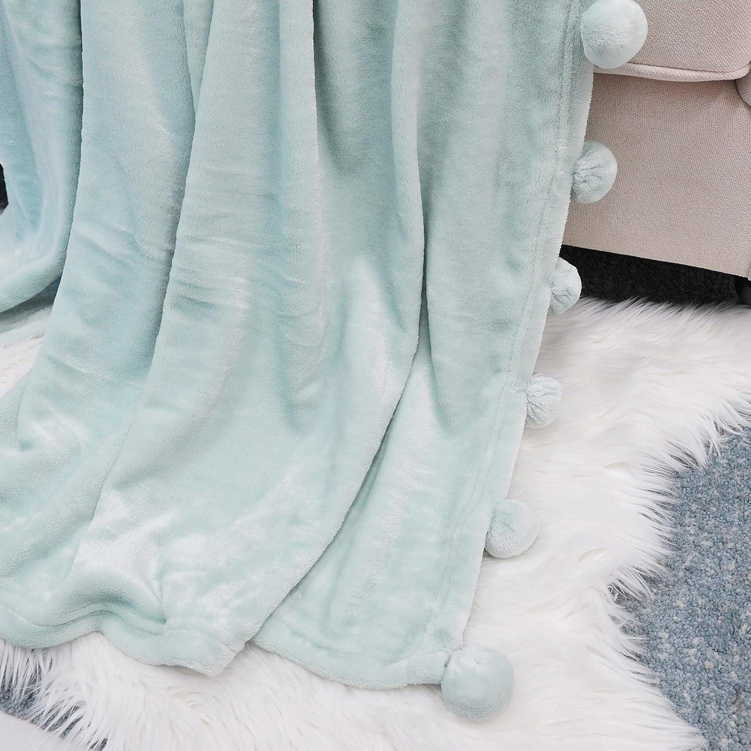 Demott Flannel Fleece Pom Pom Blanket