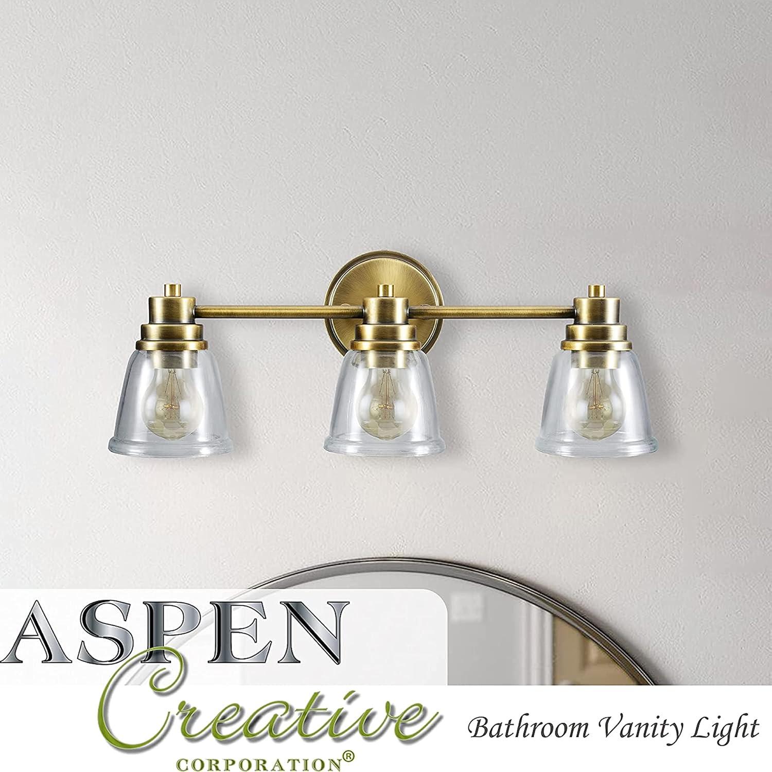 Aspen Creative 62283, Bathroom Vanity 1 Light Fixture, 5" W x 7-7/8" H x 6-3/4" E, Warm Brass Finish, Clear Glass, Bulb Not Included