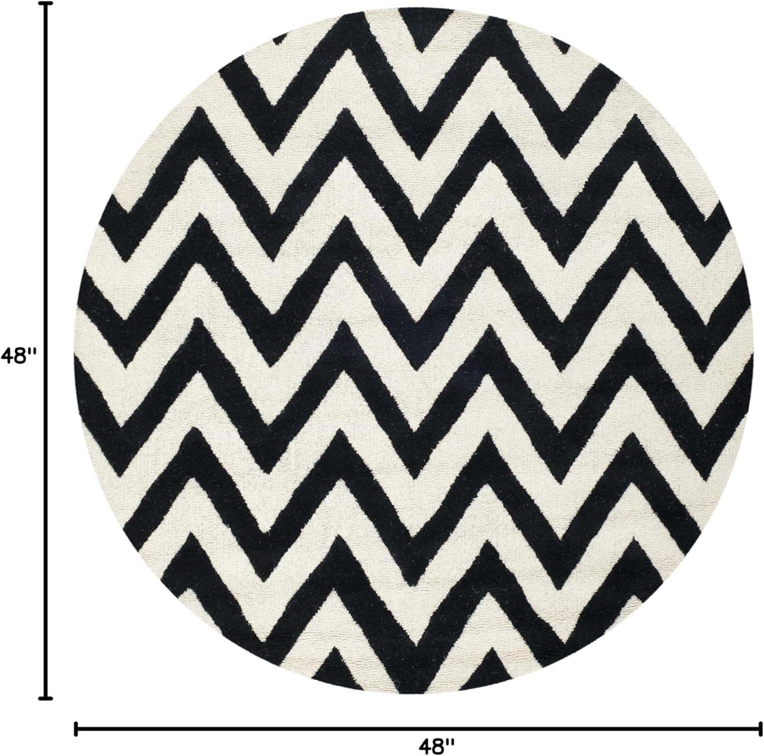 SAFAVIEH Cambridge Kaitlyn Zig Zag Stripes Wool Area Rug, Black/Ivory, 4' x 4' Round