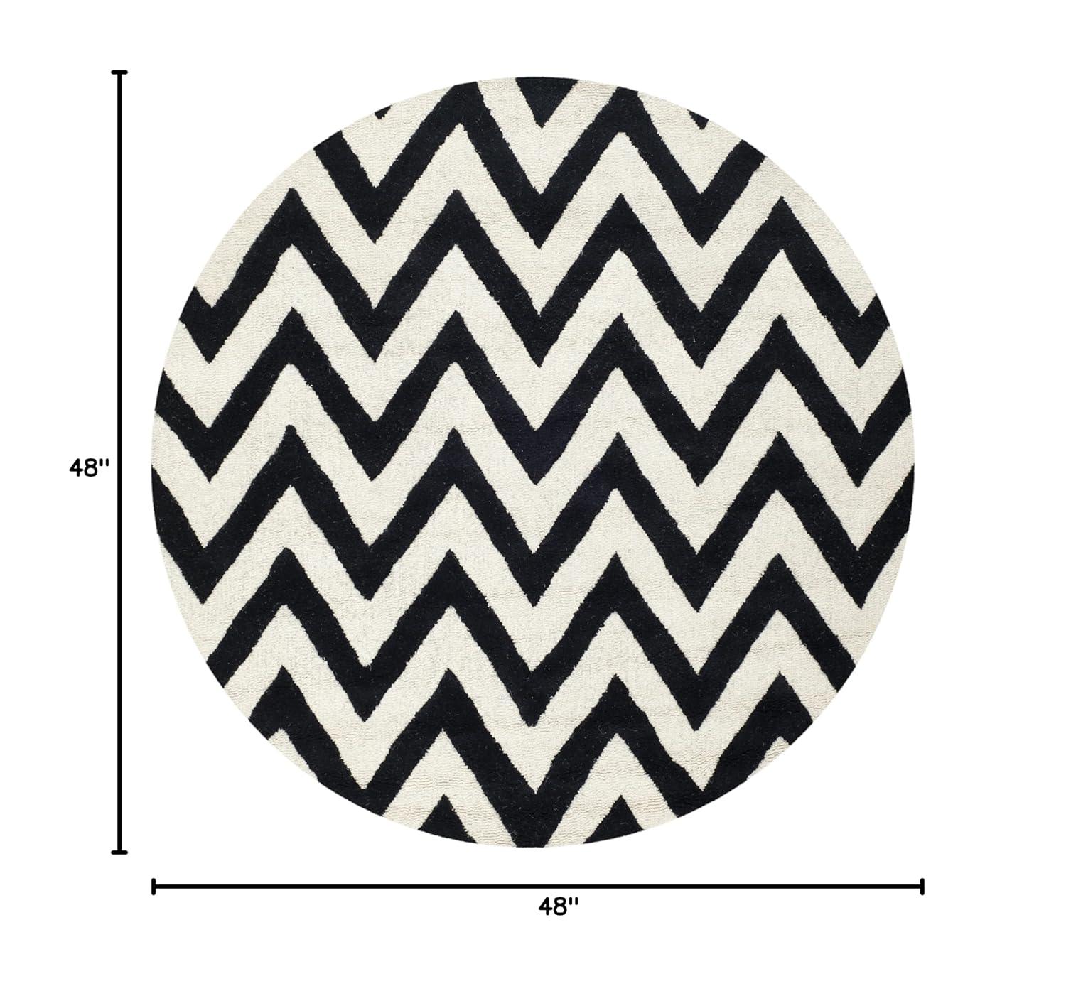 SAFAVIEH Cambridge Kaitlyn Zig Zag Stripes Wool Area Rug, Black/Ivory, 4' x 4' Round