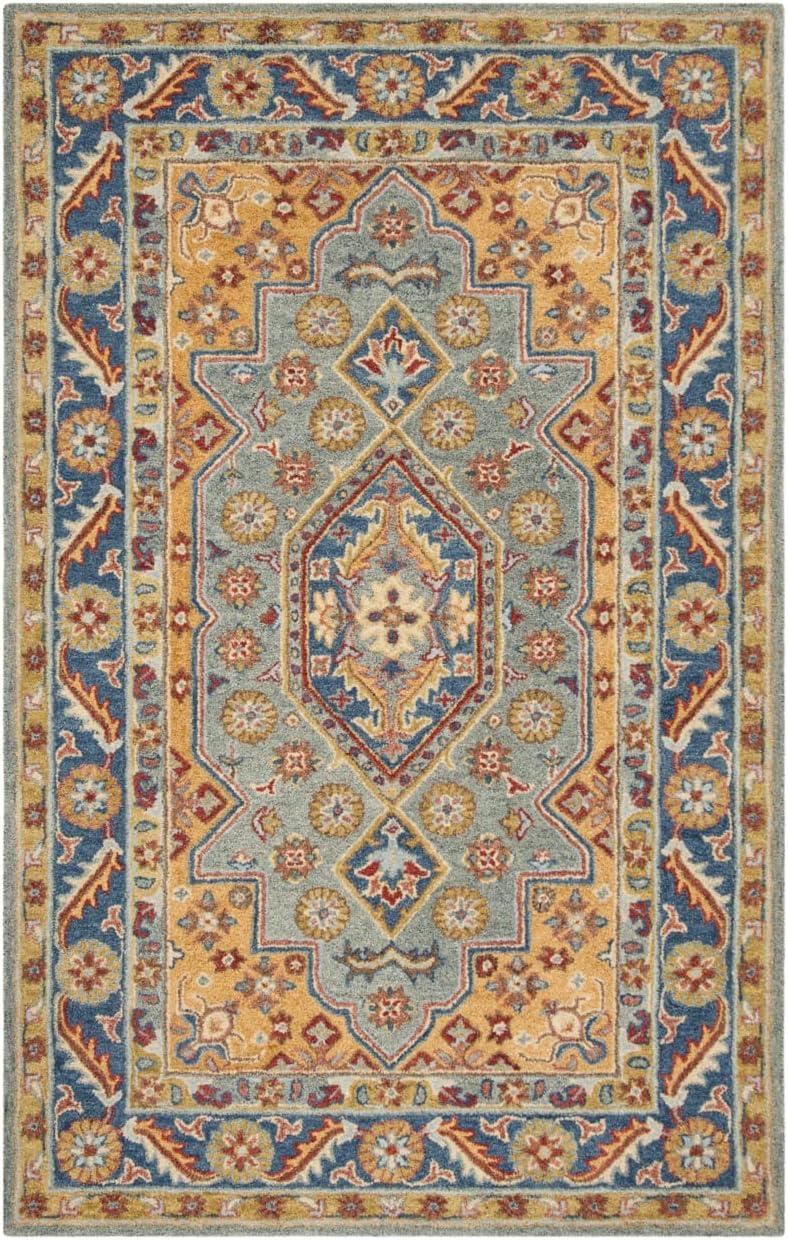 Antiquity AT504 Hand Tufted Area Rug - Blue/Gold - 5'x8' - Safavieh.