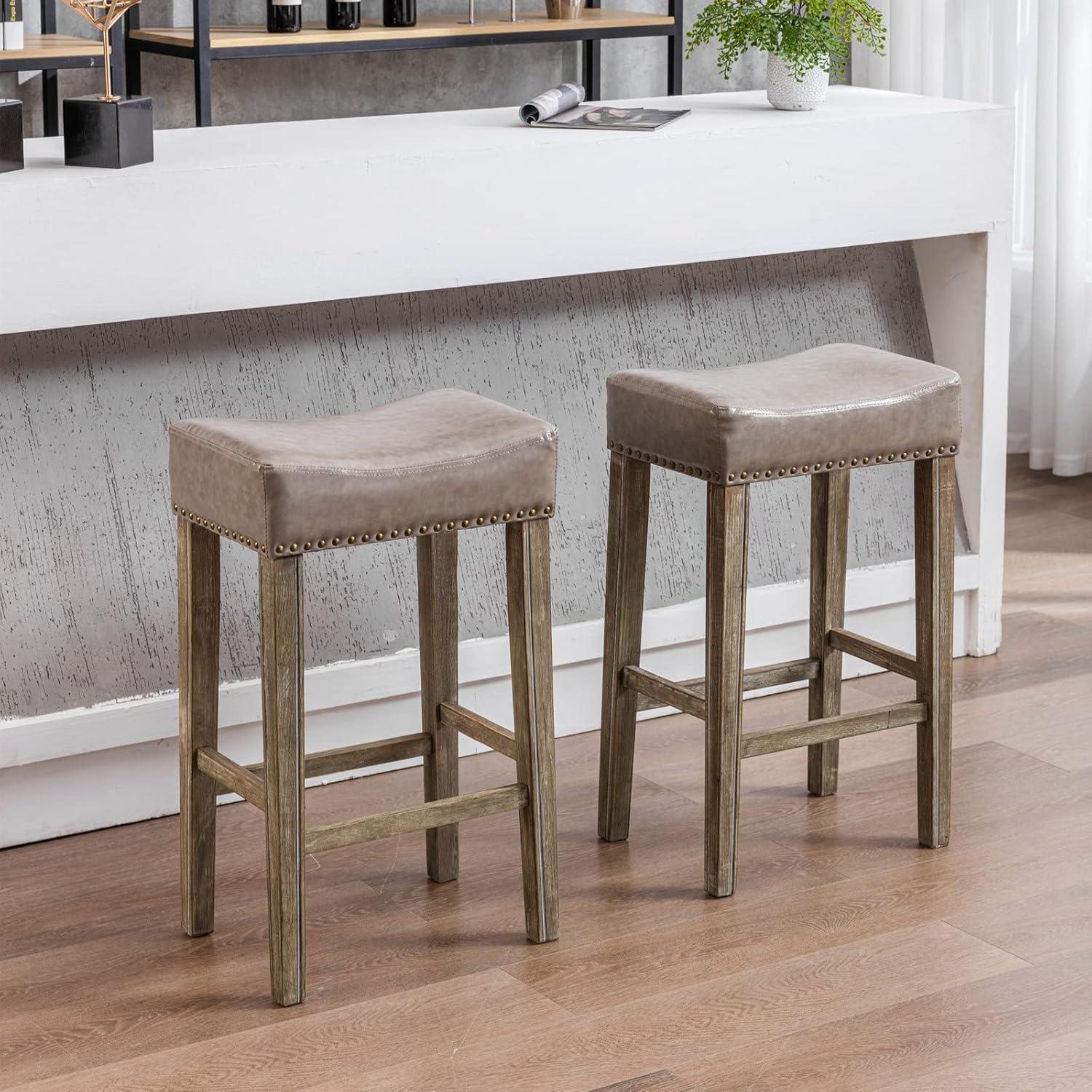Bar Stools Set of 2, 26" Faux PU Leather Upholstered Counter Height Backless Saddle Stools with Nailhead Trims and Solid Wood Legs Farmhouse Island Chairs for Kitchen Dining Room Pub, Gray