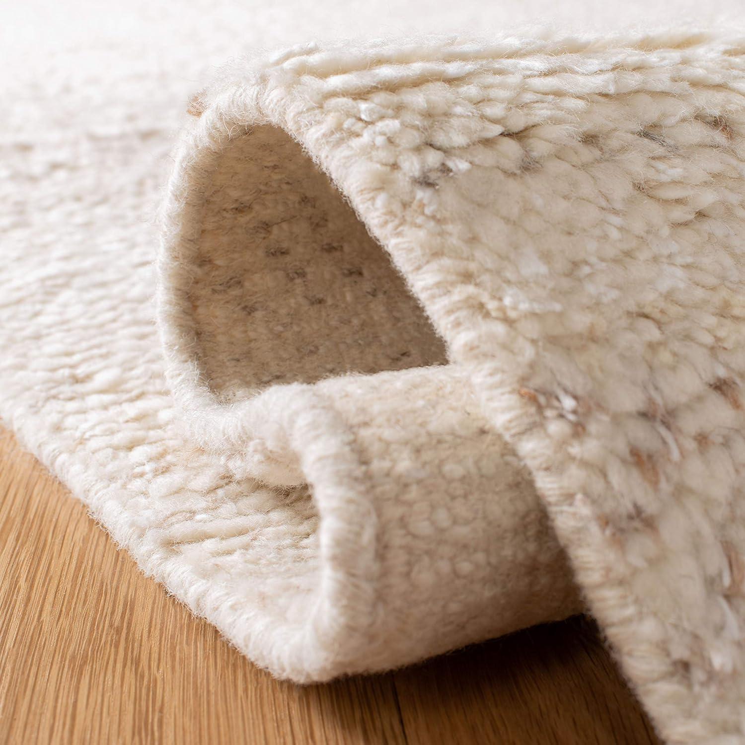 SAFAVIEH Casablanca Carbrey Solid Wool Shag Area Rug, Beige, 4' x 6'