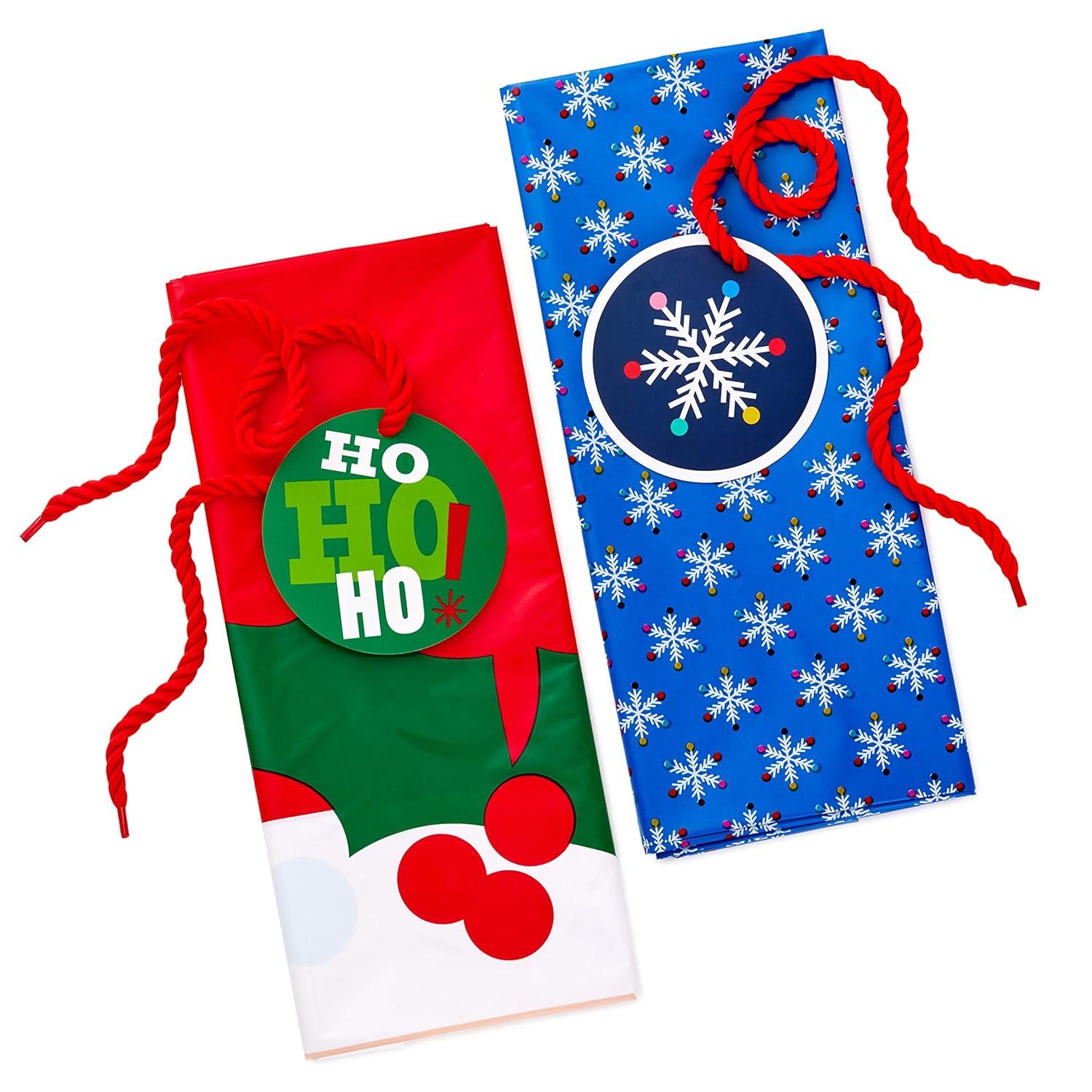 Hallmark Jumbo Plastic Christmas Gift Bags with Gift Tags and Tie Cords (2 Bags: Santa Claus Face, Rainbow Snowflakes on Blue)