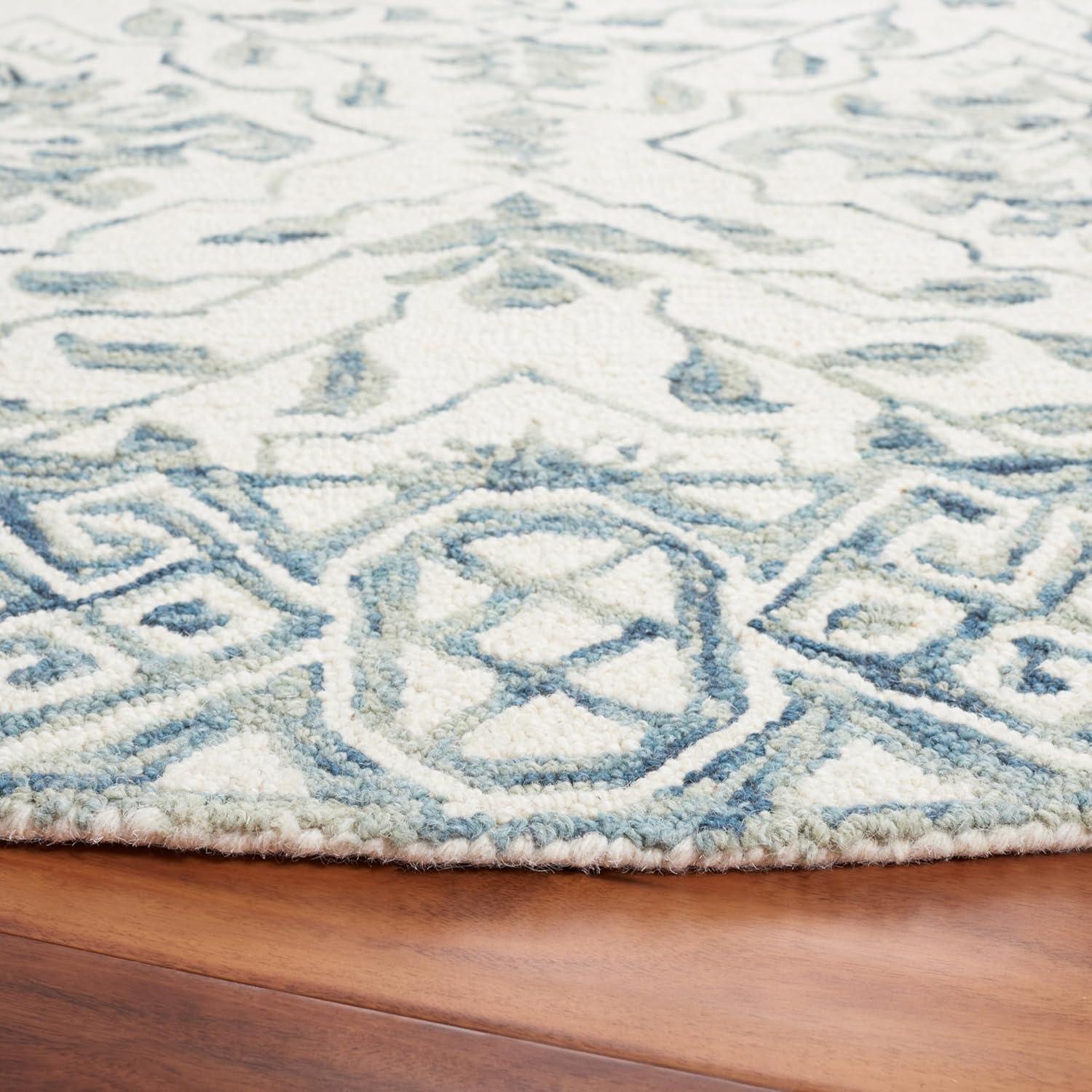 Handmade Light Blue and Ivory Tufted Wool Round Rug