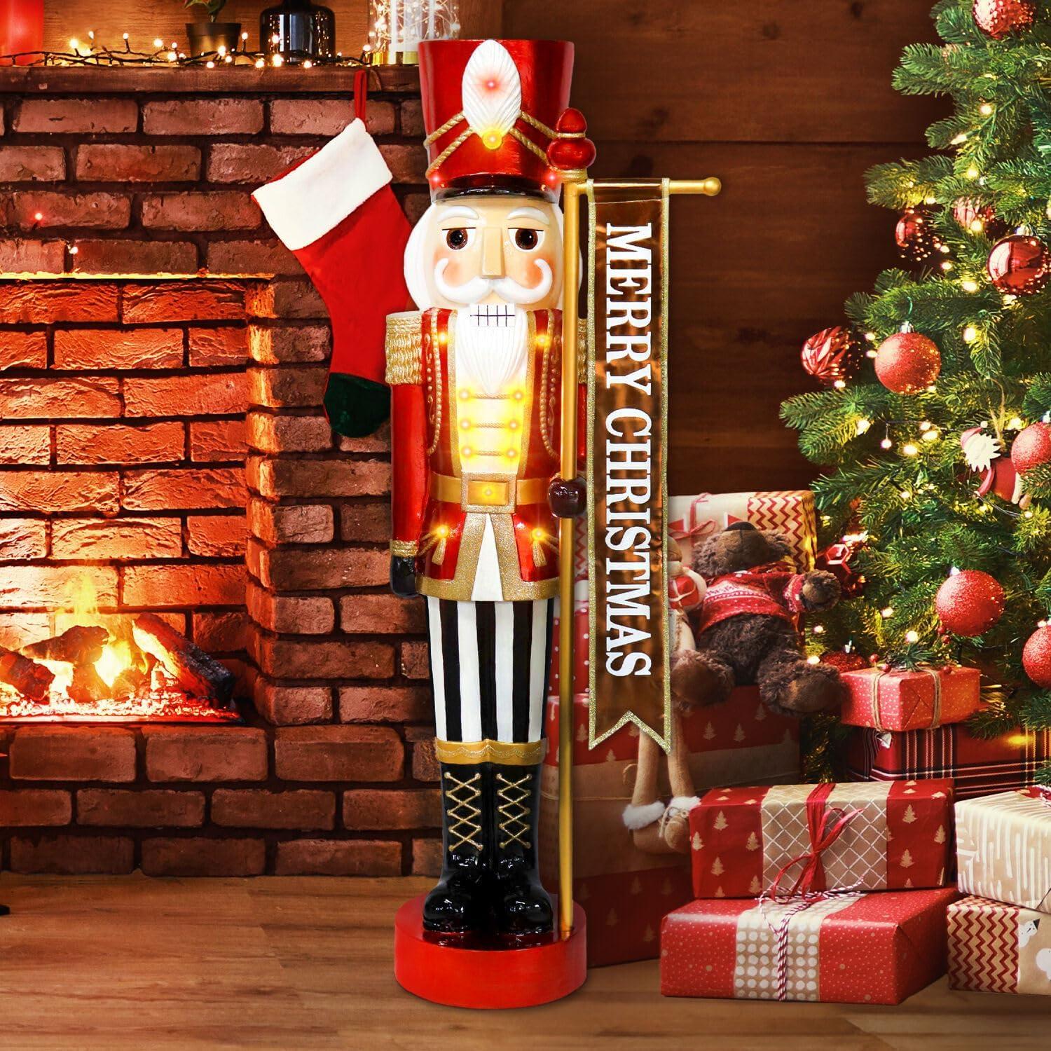 Fraser Hill Farm 4-Ft. Metallic Nutcracker Holding Banner Statue with LED Lights