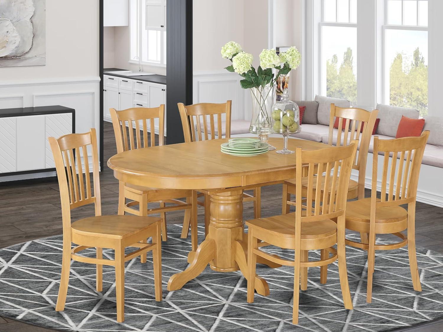 East West Furniture AVGR7-OAK-W 7 Piece Formal Dining Room Set-Oval Dinette Table With Leaf and 6 Dining Chairs