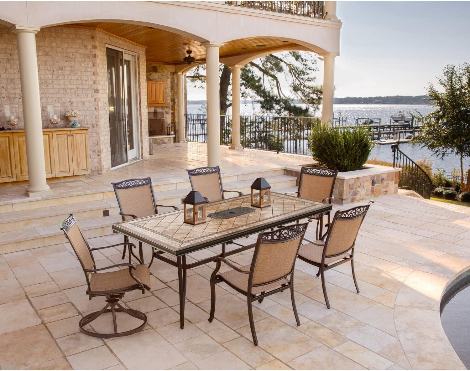 Hanover Fontana 7-Piece Outdoor Dining Set with 2 Sling Swivel Rockers, 4 Sling Chairs, and a 38-In. x 72-In. Cast-Top Table