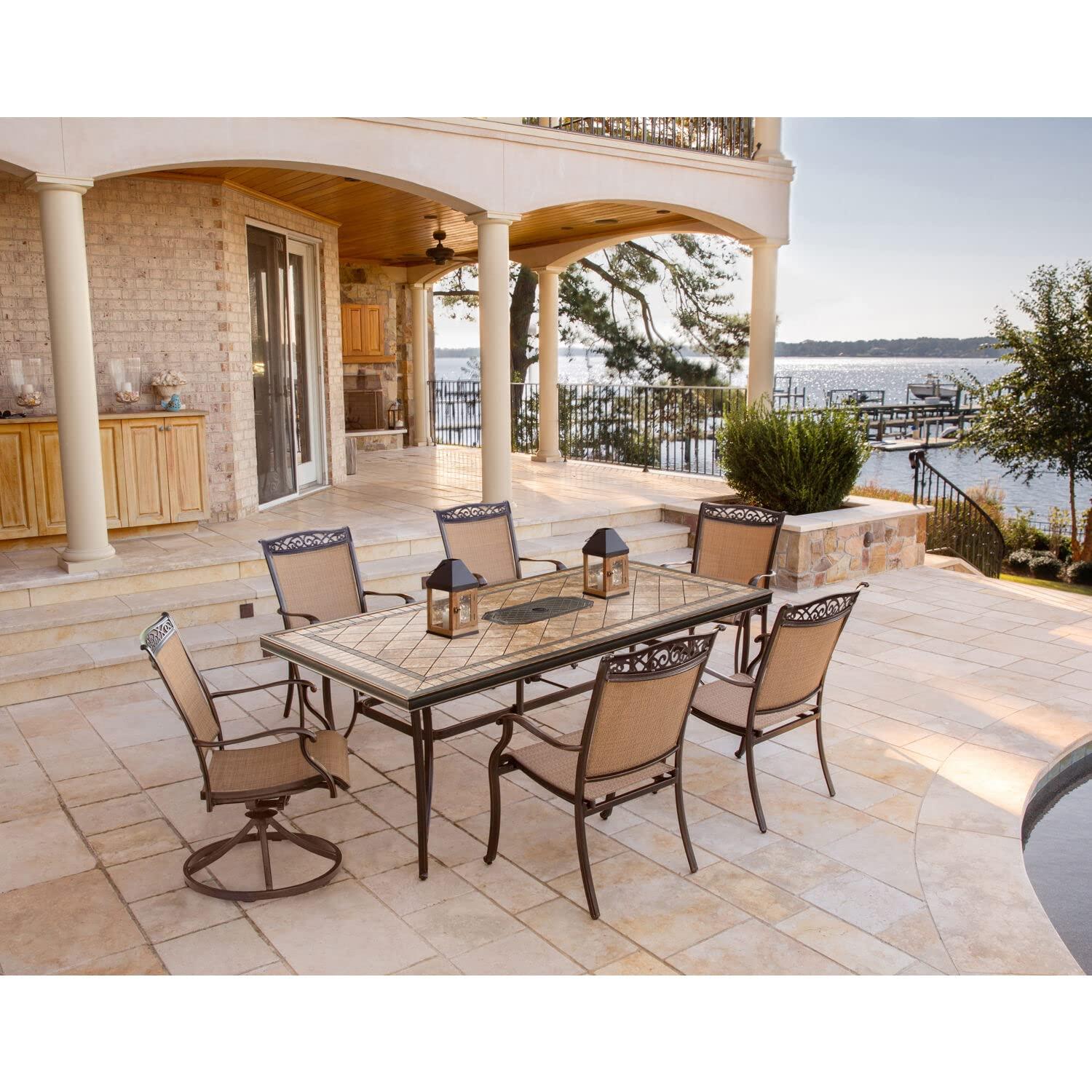 Hanover Fontana 7-Piece Outdoor Dining Set with 2 Sling Swivel Rockers, 4 Sling Chairs, and a 38-In. x 72-In. Cast-Top Table