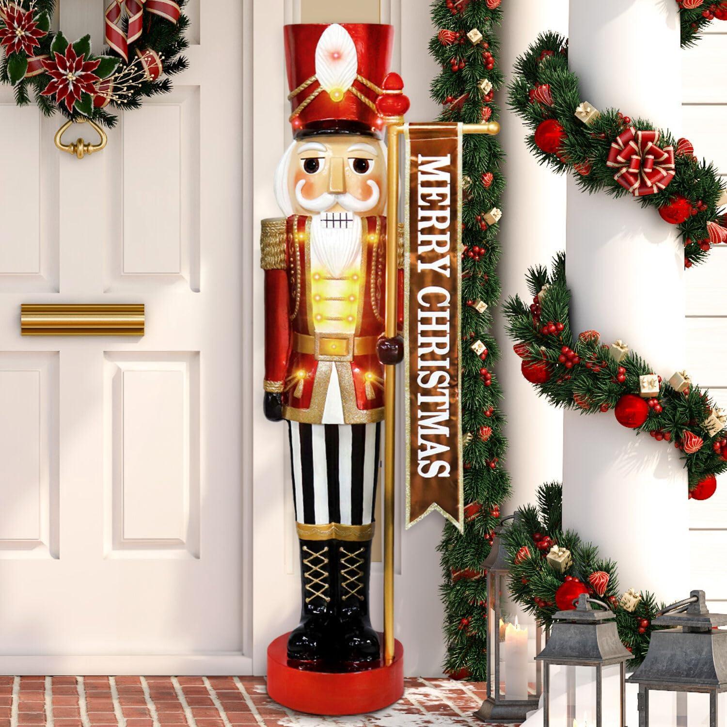 Fraser Hill Farm 4-Ft. Metallic Nutcracker Holding Banner Statue with LED Lights