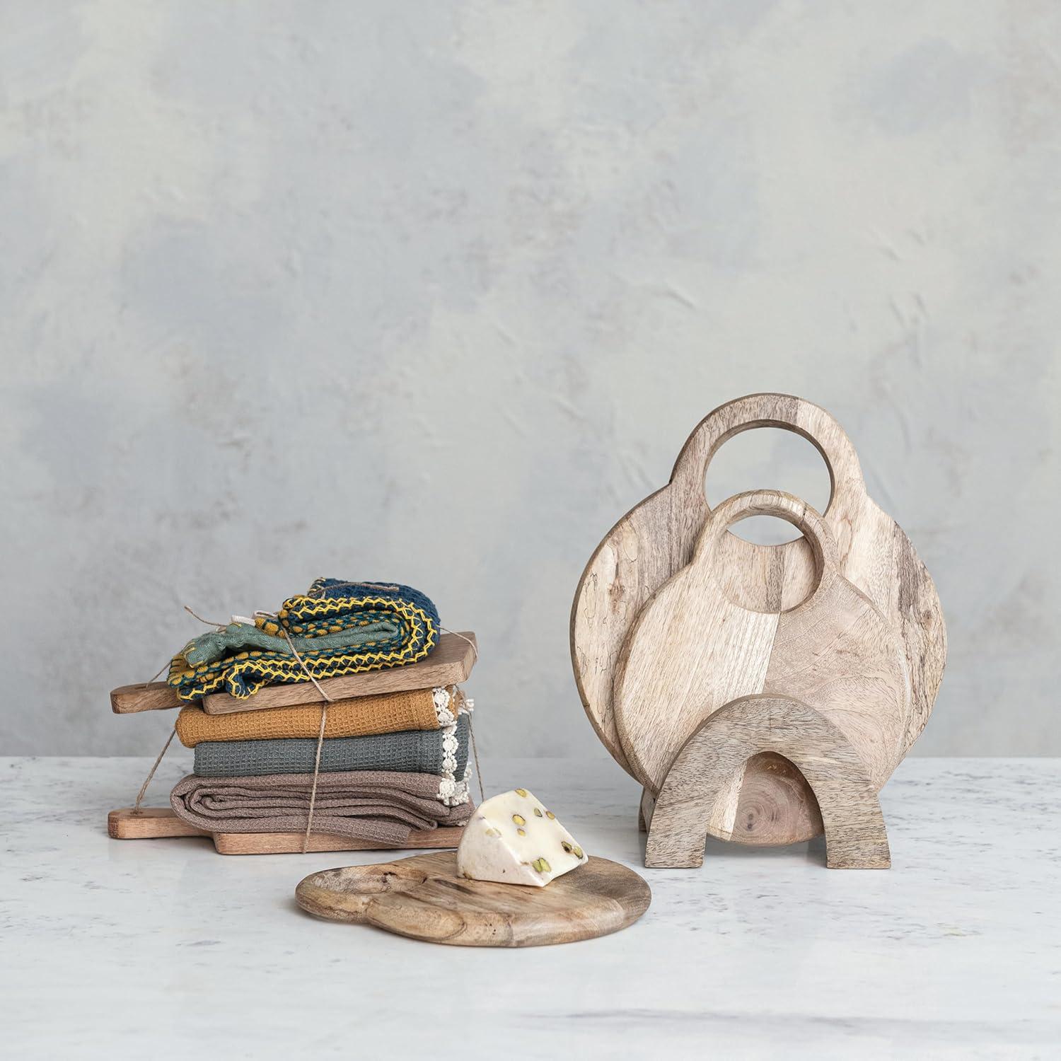 Creative Co-Op 3-Piece Round Mango Wood Cutting Boards In Various Sizes With Stand