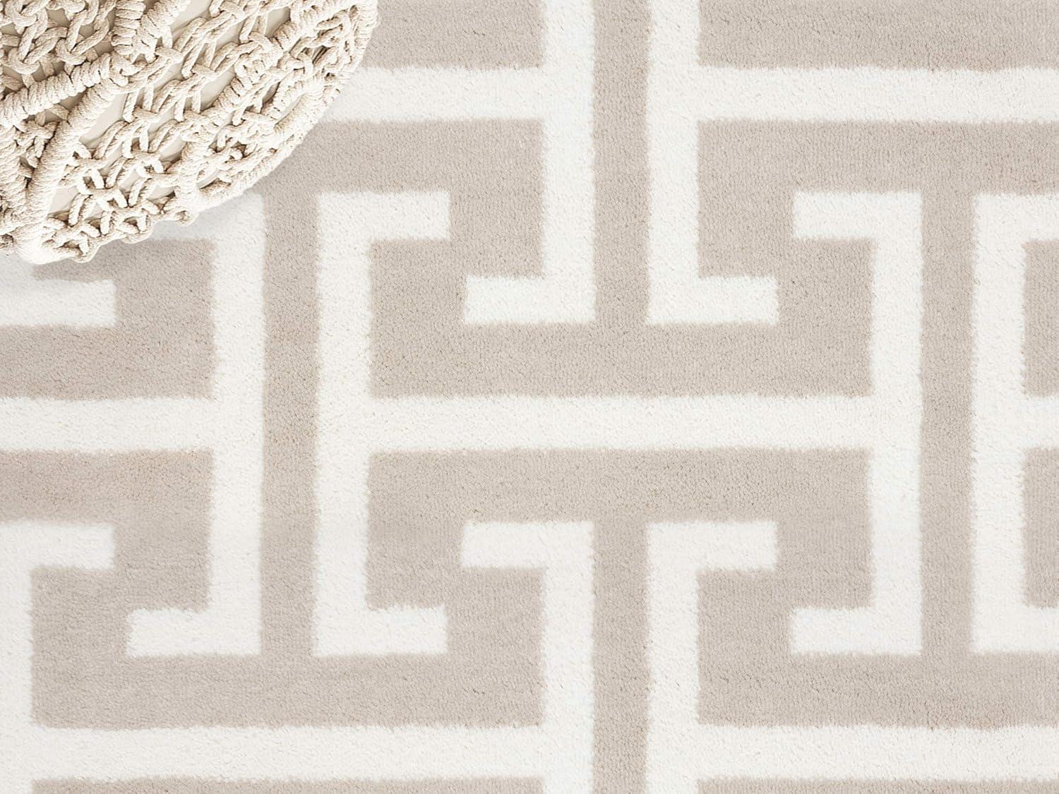 Beige and White Geometric 4' x 6' Synthetic Area Rug
