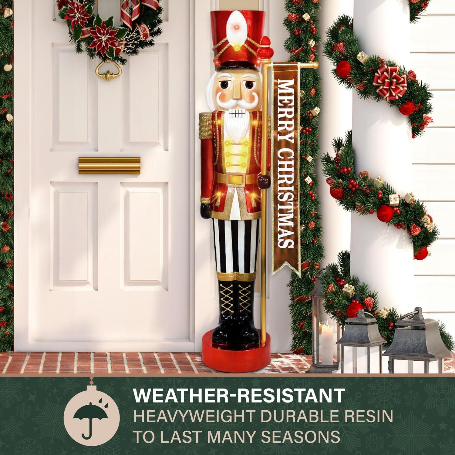 Fraser Hill Farm 4-Ft. Metallic Nutcracker Holding Banner Statue with LED Lights