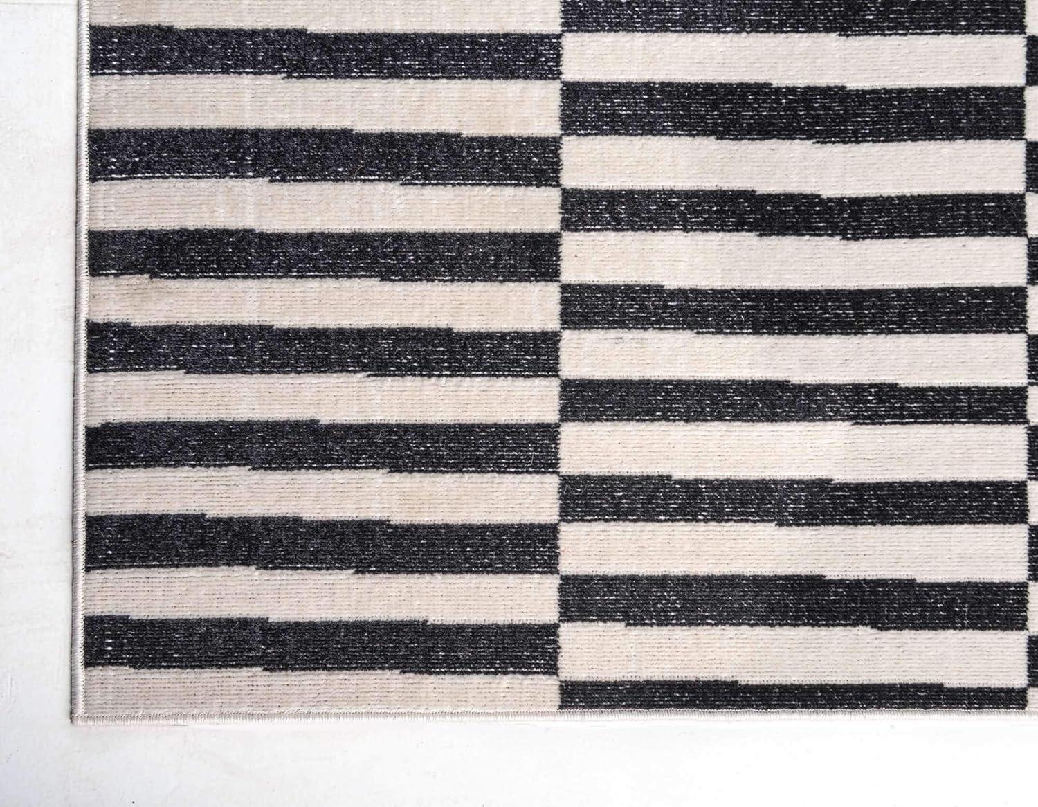 Black and Ivory Striped Synthetic 4' x 6' Area Rug