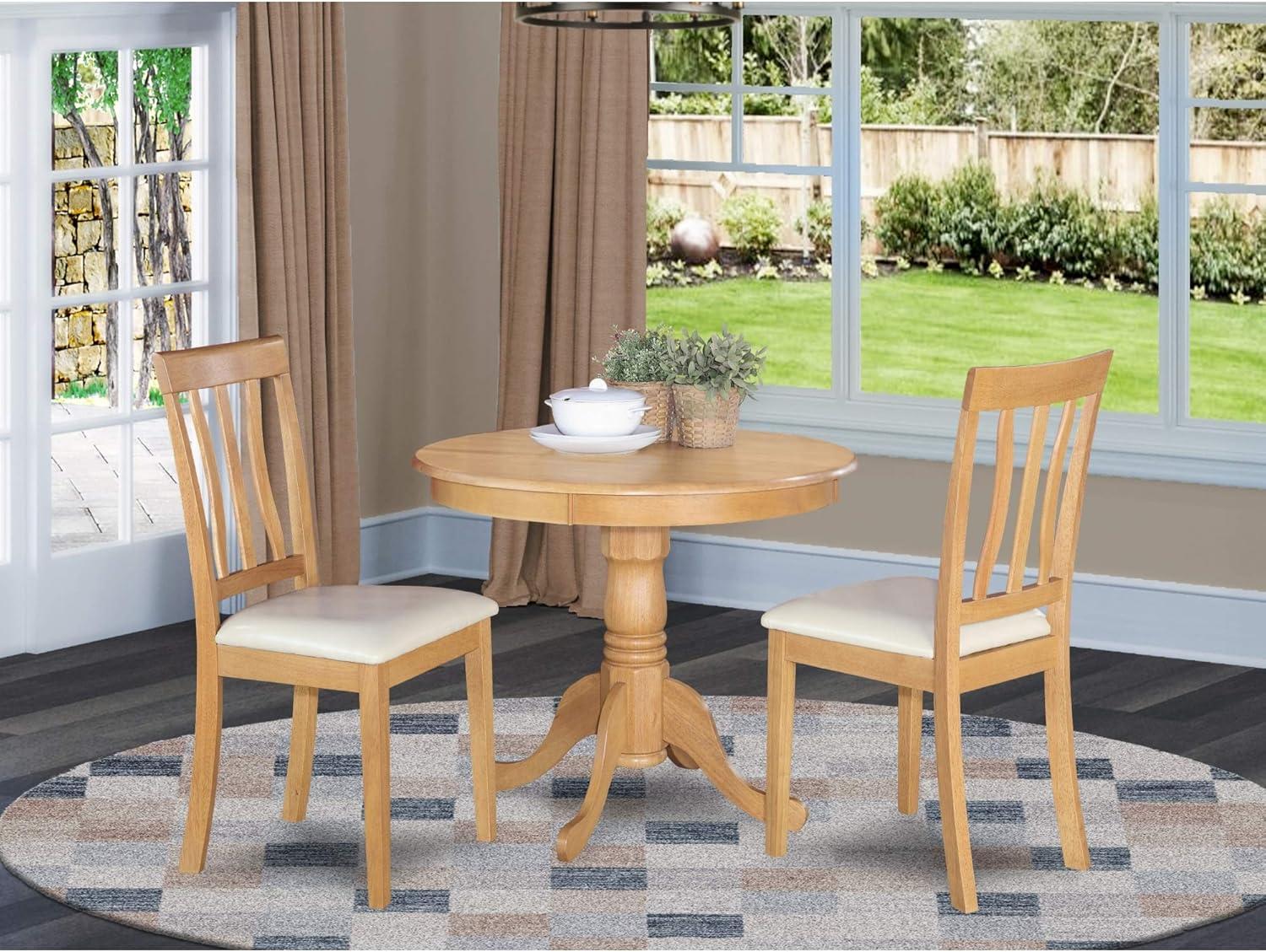 Oak Finish 3-Piece Round Pedestal Dining Set with Faux Leather Chairs