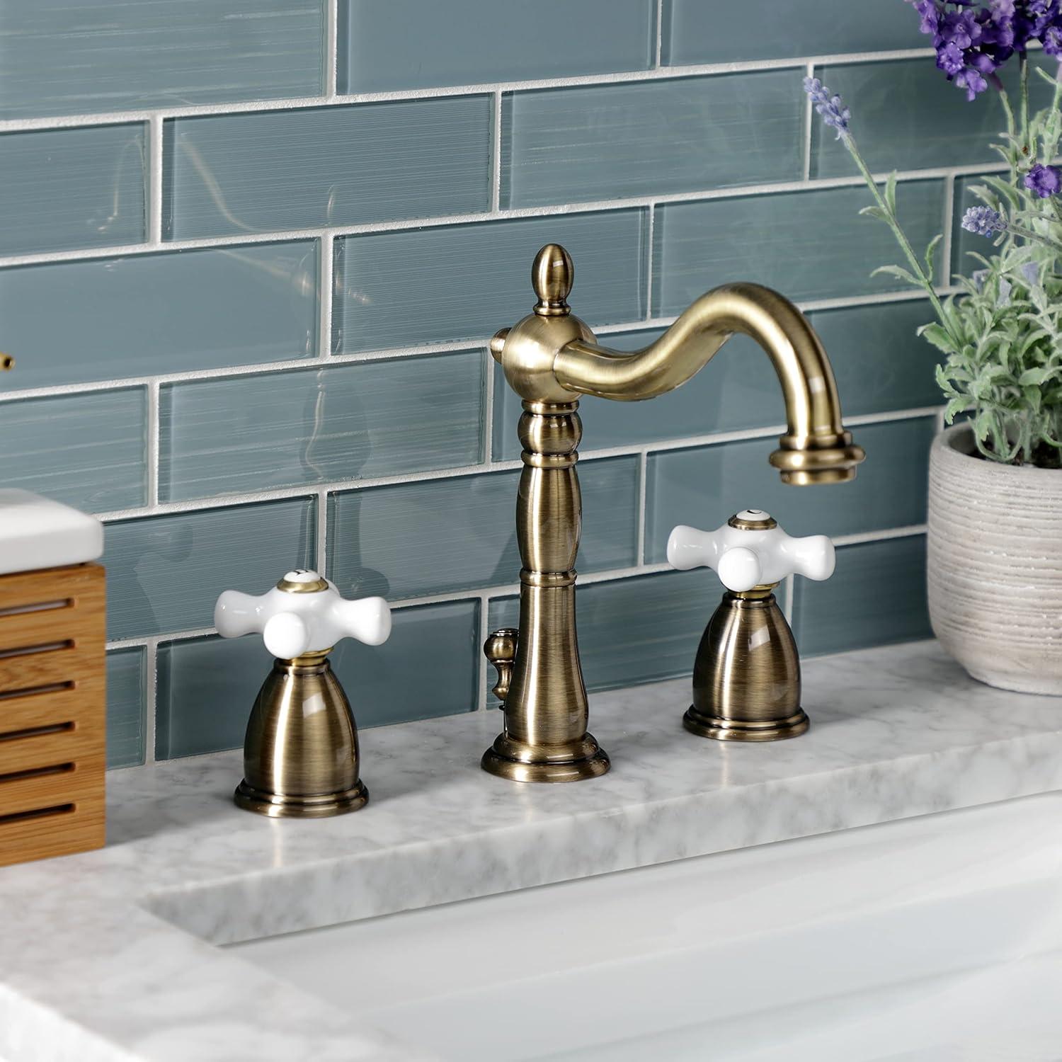 Kingston Brass Heritage Two-Handle 3-Hole Deck Mount Widespread Bathroom Faucet with Pop-Up Drain