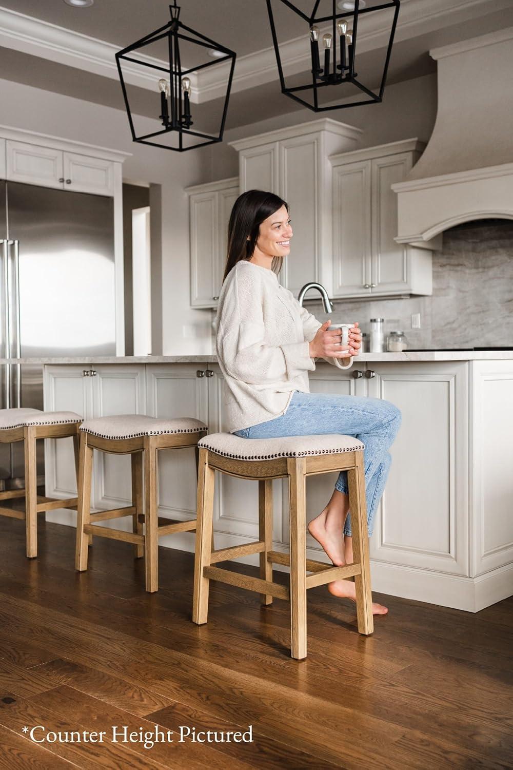 Maven Lane Adrien 31 Inch Bar Height Upholstered Backless Saddle Barstool in Natural Wood Finish with Wheat Cream Fabric Cushion Seat, Set of 2