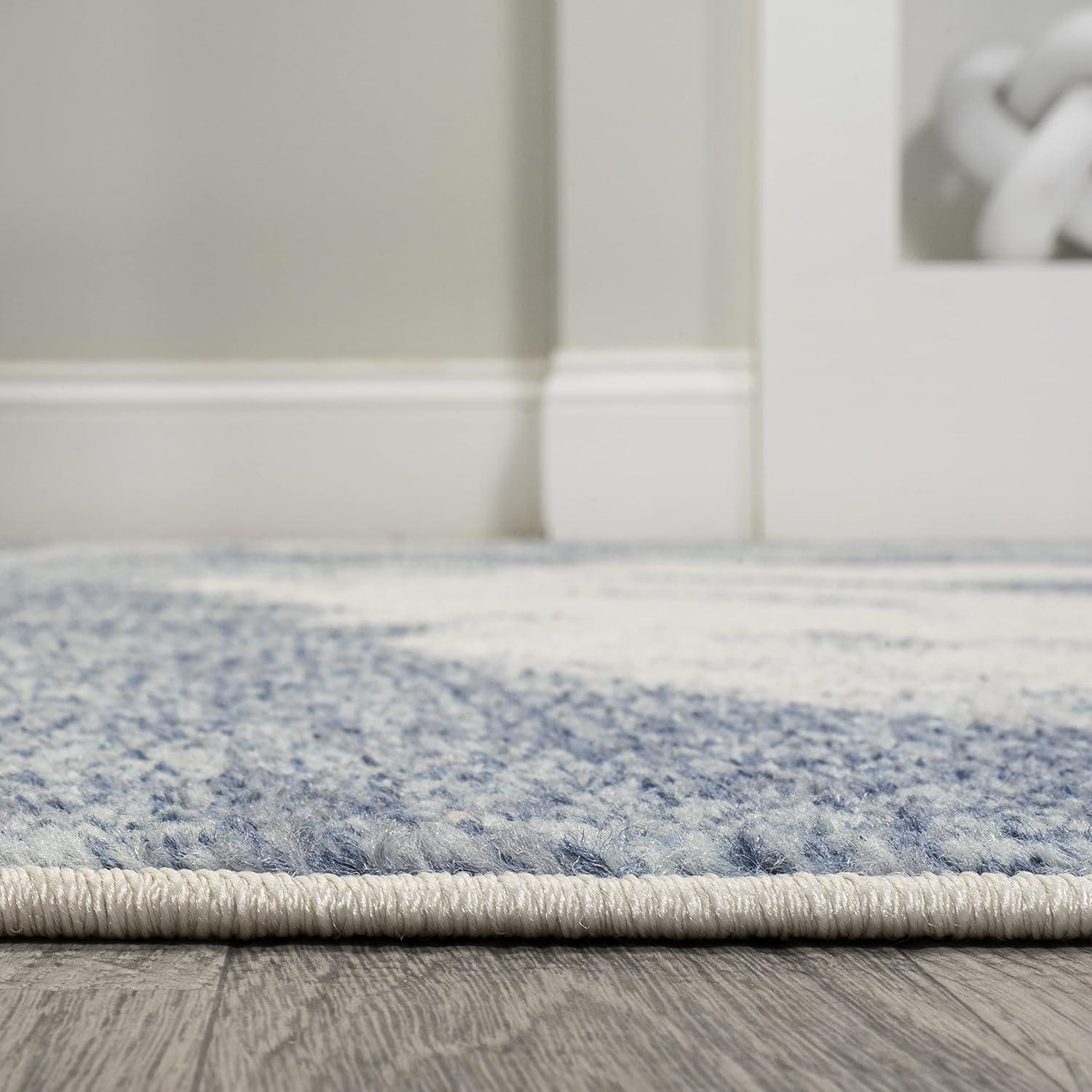 Blue and Cream Abstract Synthetic 8' x 10' Reversible Area Rug