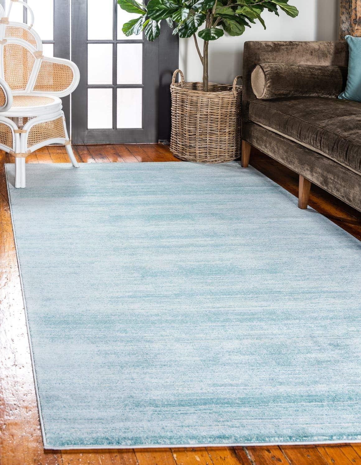 Turquoise and Ivory 8' x 10' Washable Synthetic Area Rug