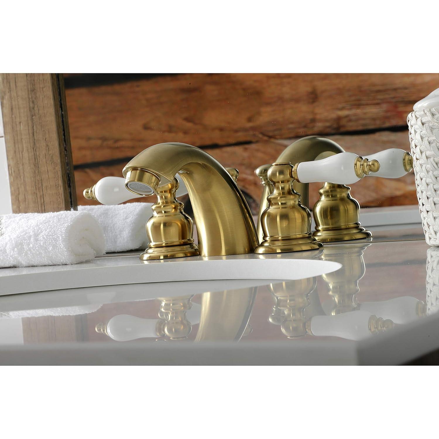 Kingston Brass Victorian Two-Handle 3-Hole Deck Mount Mini-Widespread Bathroom Faucet with Plastic Pop-Up